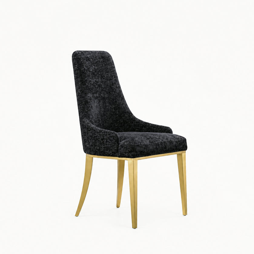 Front view of Stylus high-back dining chair in black textured fabric with gold metal legs.