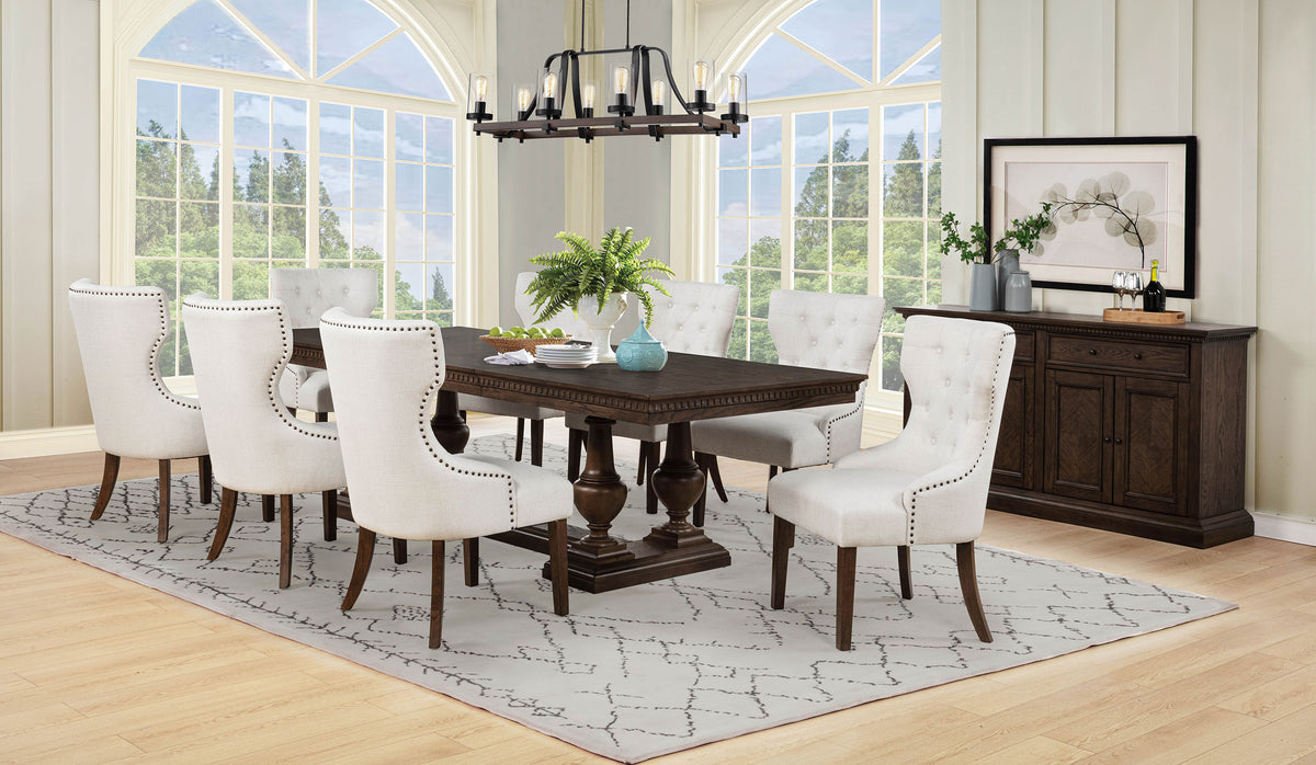 Baney Ridgewell Dining Collection - Trestle Extension or Round Pedestal Table, Tufted Wingback Chairs in Dark Oak