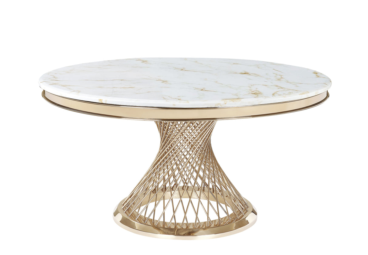 Round white marble dining table with gold veining and a sculptural gold metal base in a contemporary room.