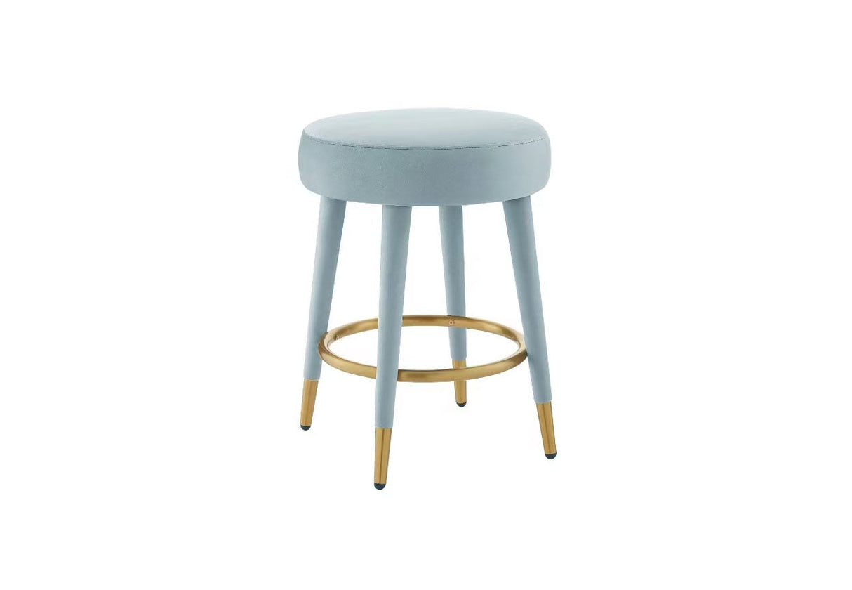 Front view of Ollie black velvet round counter stool with gold tipped legs.