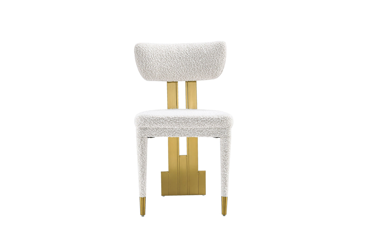 Close-up of the textured white fabric and gold back support on the Amari Dining Chair.