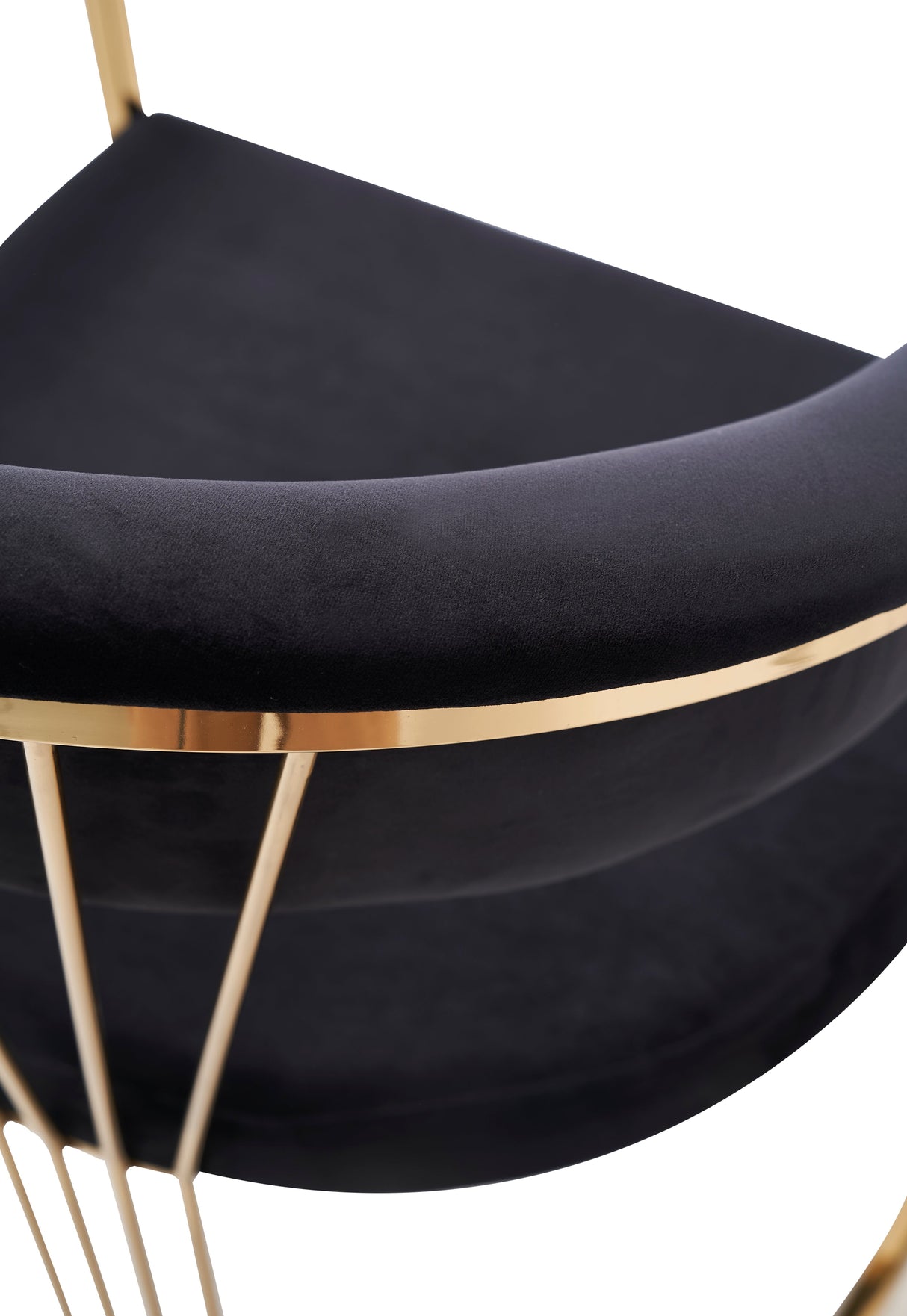 Wide shot of FOAK grey velvet chair against a neutral background.