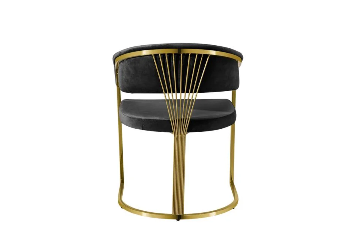 Side profile of open-back Annie dining chair in grey and gold.