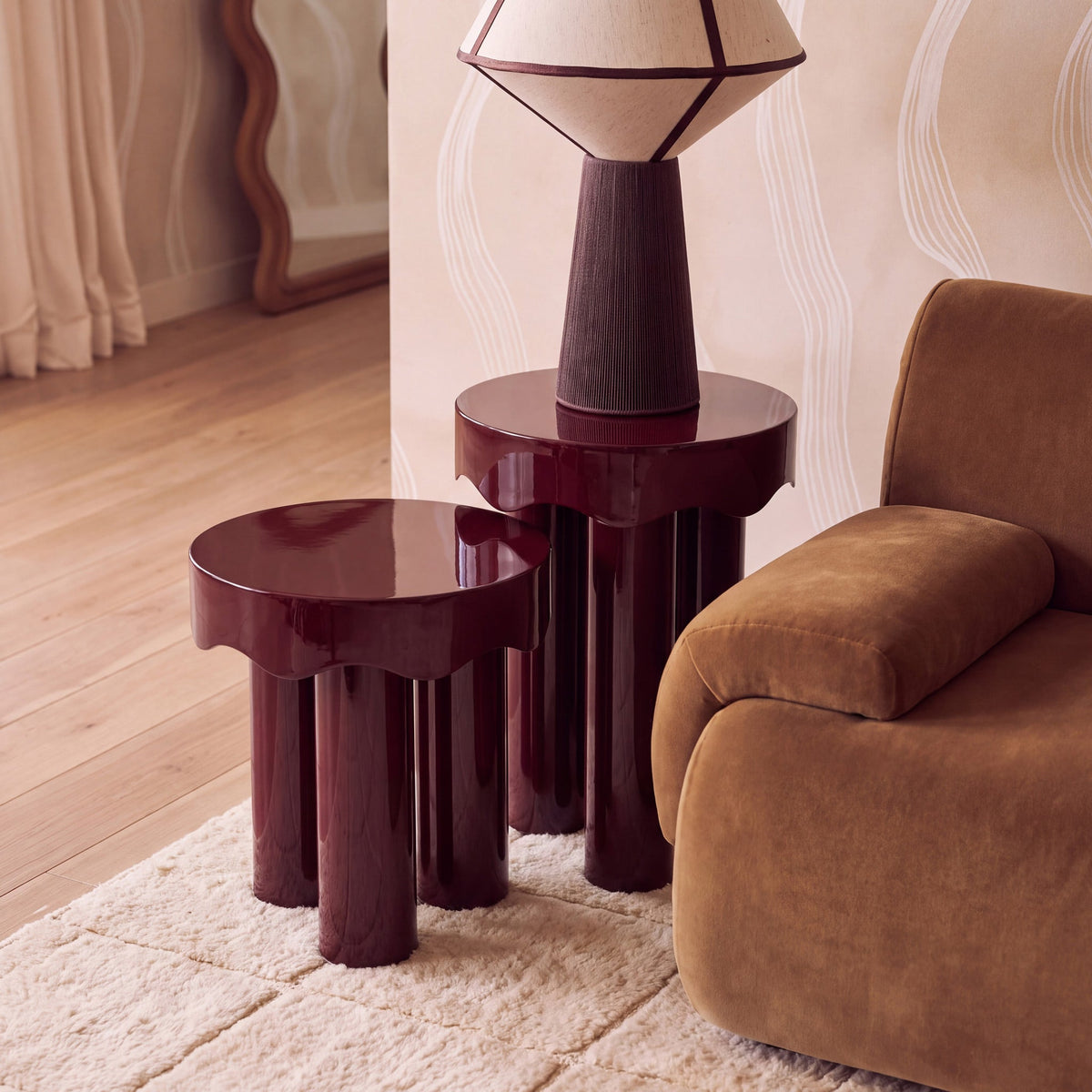 Top view of the burgundy lacquered finish on Casper nesting accent tables