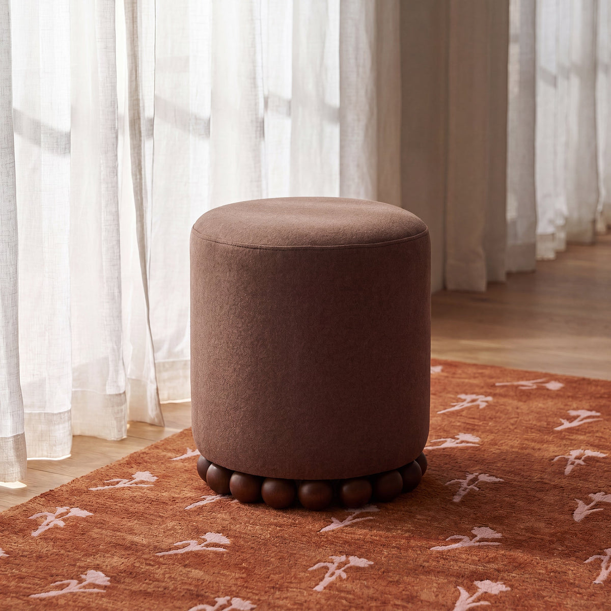 Dex footstool in transitional family room arrangement