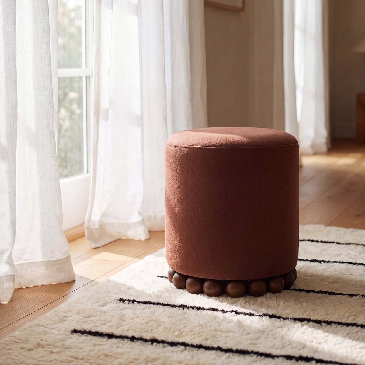 Dex round ottoman silhouette highlighting clean transitional lines