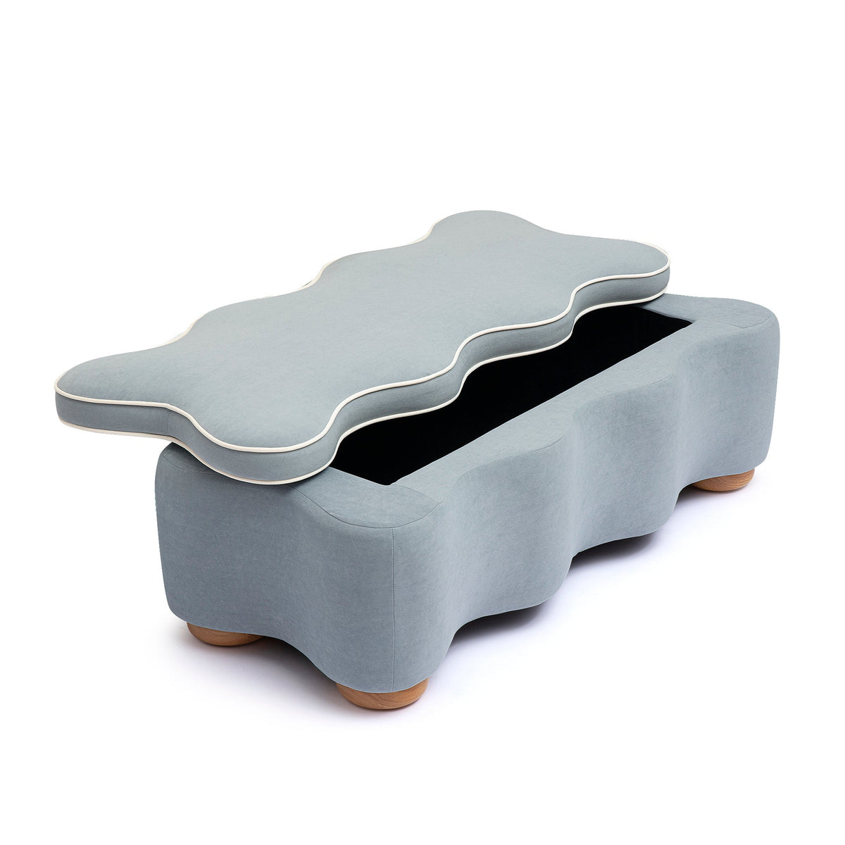 Thalia blue velvet storage bench placed under a window in living room