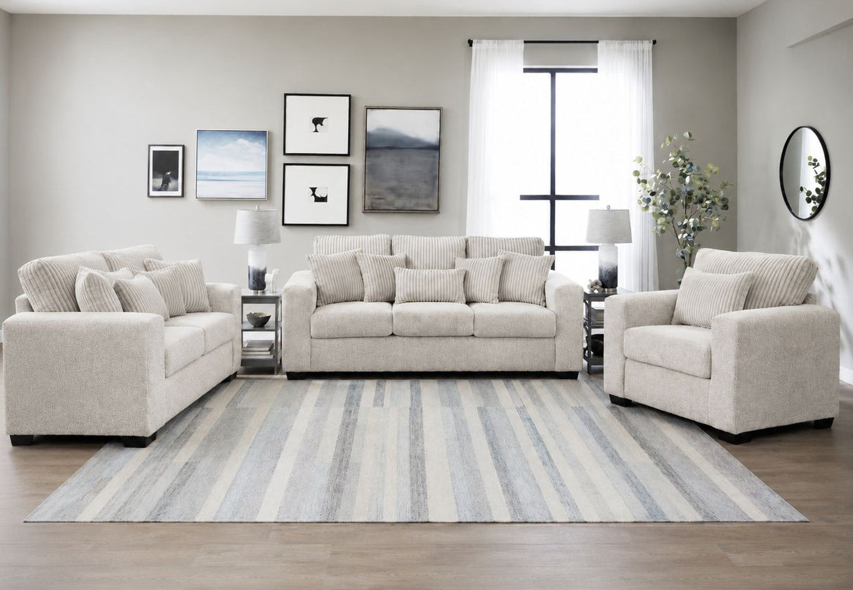 Janet 3-piece living room set featuring a sofa, loveseat, and armchair in textured fabric upholstery with wide track arms.