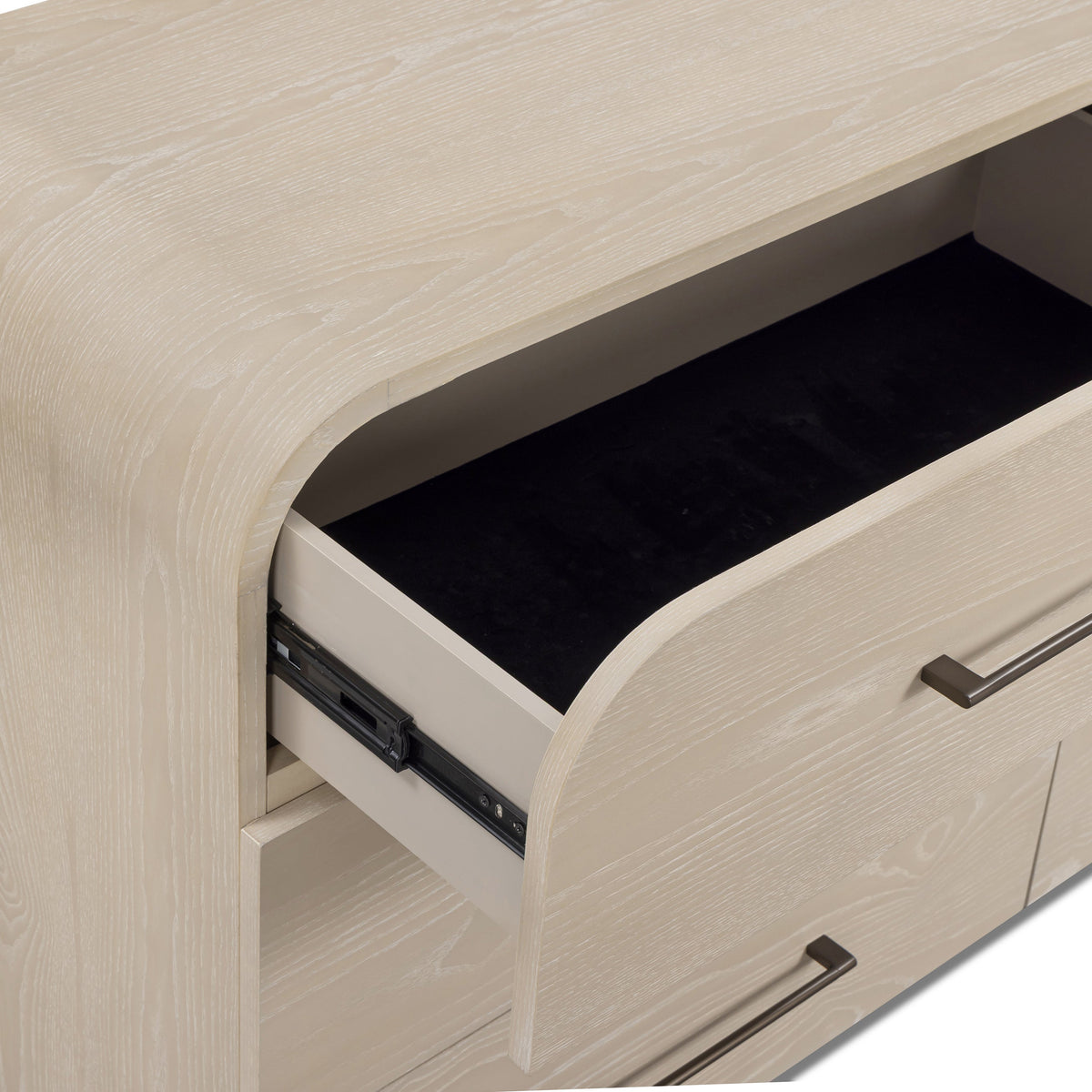 Three quarter room angle showing the sculptural silhouette of the 6 drawer dresser