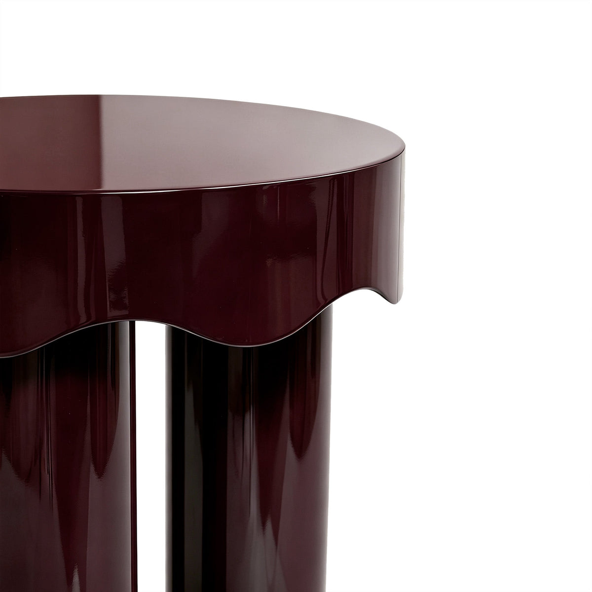 Burgundy Casper nesting side tables arranged apart as separate companion accent tables