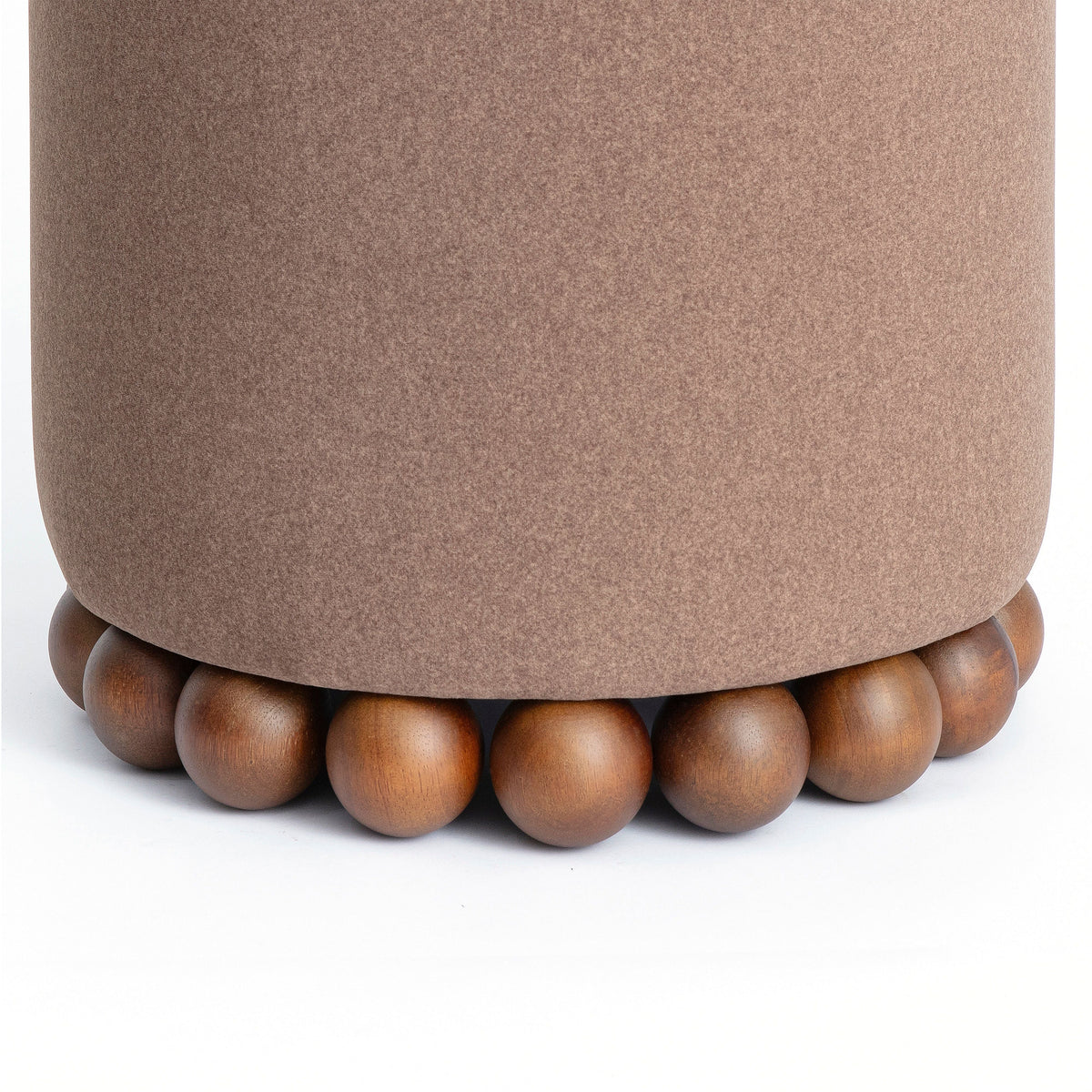 Top cushion firmness demonstration on Dex round ottoman