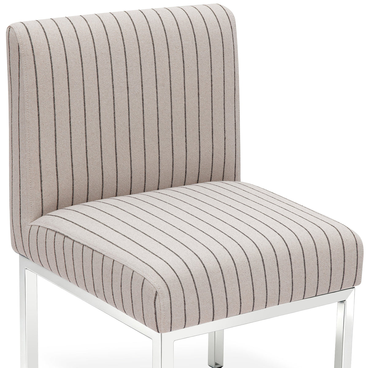 Pensel Dining Chair in Black and Natural fabric pattern positioned at a modern dining table