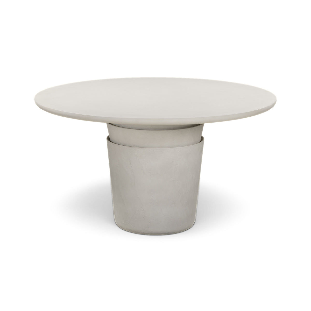Side profile of Margot indoor outdoor round dining table showcasing organic Wabi Sabi silhouette