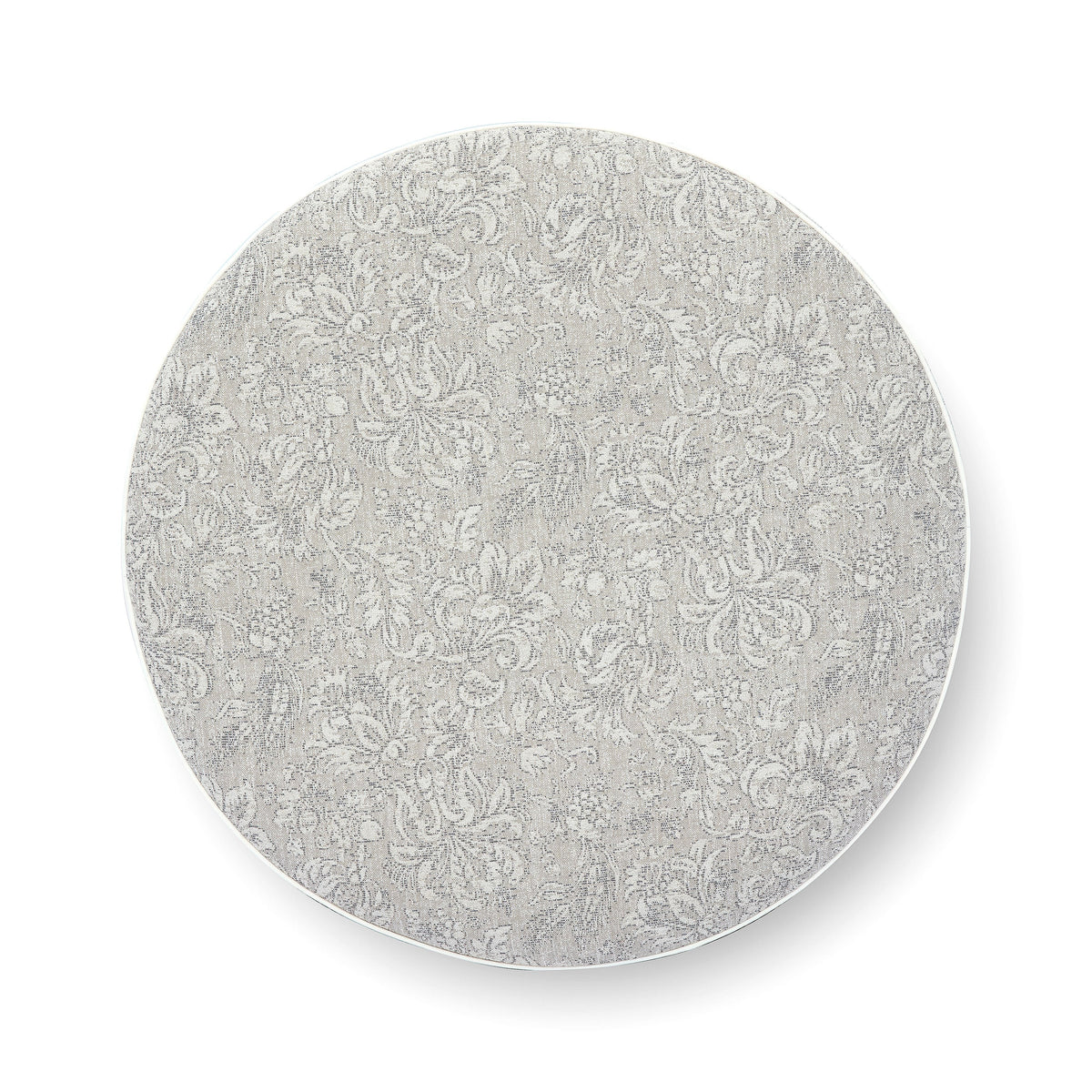 Close view of durable welt cord piping around the rim of Tassy Round Ottoman