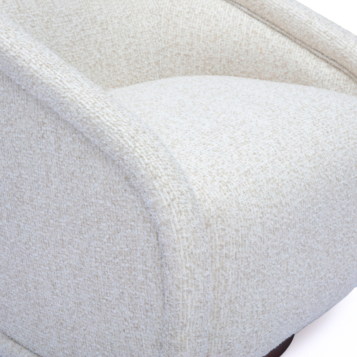 Back profile view of modern curved shelter back Clarke cream boucle armchair