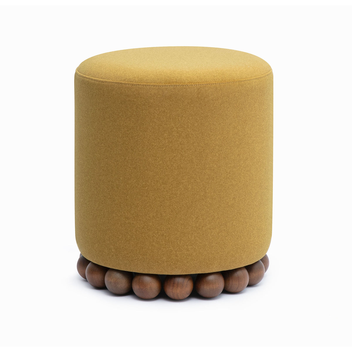 Dex ottoman low angle showing elevated wooden ball base