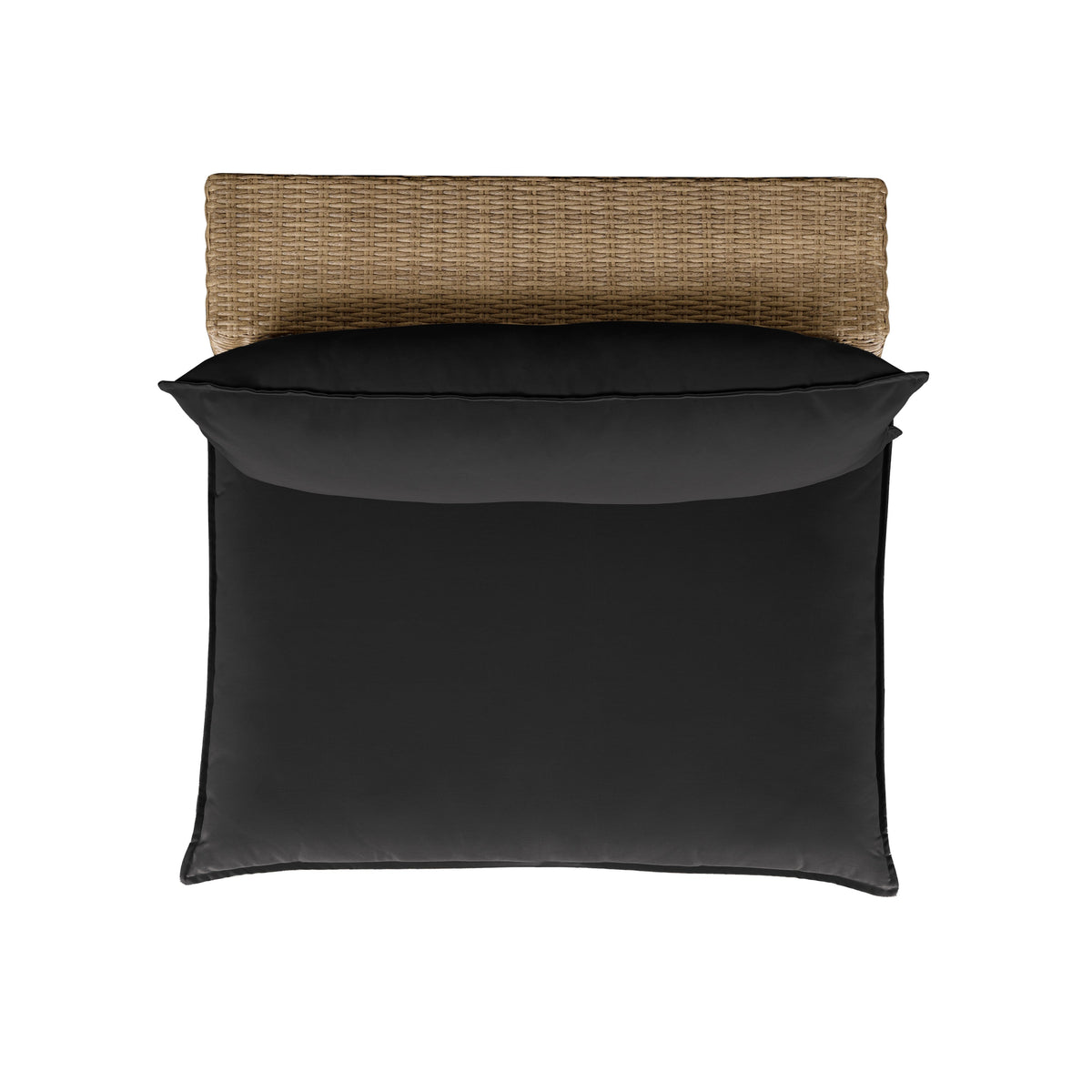 Three-quarter view of the natural wicker Cali patio chair featuring cream cushions