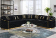 Contemporary corner sectional upholstered in gray velvet featuring gold base accents