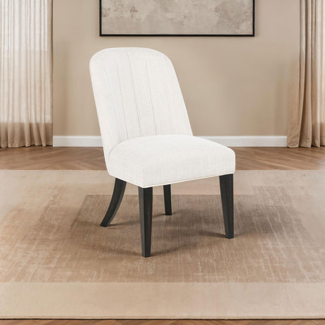 Leandro Pedestal Dining Collection - 60" Round or 78"-96" Extension Table in Burnished Black with Cream Chairs - lifestyle