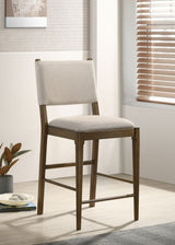 Ottowa 47" Round Counter Height Table & 5-Piece Set - Brown Oak with Tan Upholstered Counter Chairs - lifestyle