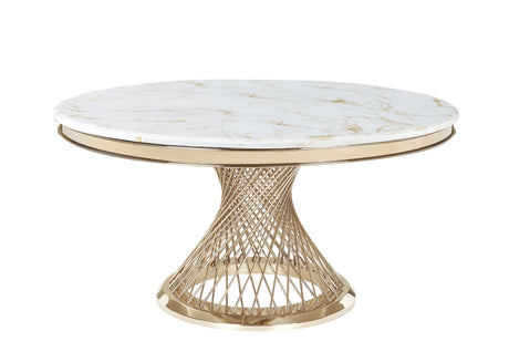 Round white marble dining table with gold veining and a sculptural gold metal base in a contemporary room.