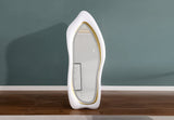 Close-up of matte finish sculptural frame contours on contemporary LED wall mirror
