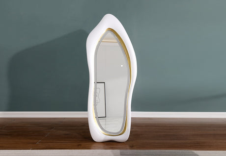 Close-up of matte finish sculptural frame contours on contemporary LED wall mirror