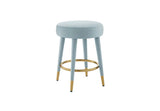 Front view of Ollie black velvet round counter stool with gold tipped legs.