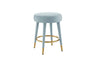Front view of Ollie black velvet round counter stool with gold tipped legs.