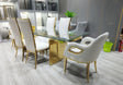 Riley contemporary dining table featuring clear tempered glass top and polished gold-plated metal base frame