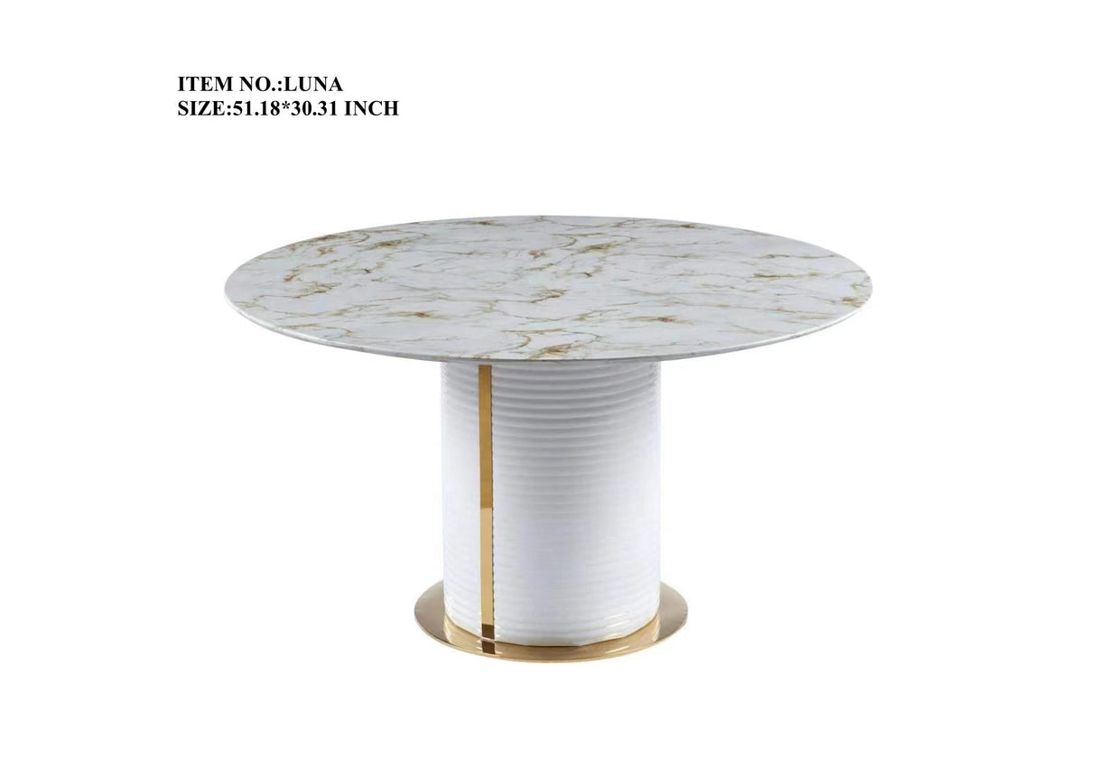 Close-up detail of the gold-tone metal trim and textured base of the Luna dining table.