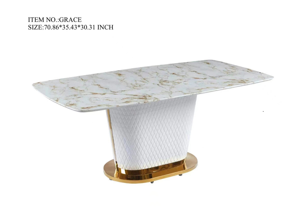 Close-up of FOAK Sofia dining table showing rectangular marble tabletop and gold-finished base accents.
