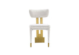Close-up of the textured white fabric and gold back support on the Amari Dining Chair.