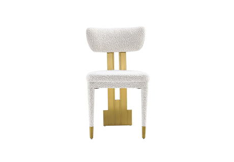 Close-up of the textured white fabric and gold back support on the Amari Dining Chair.