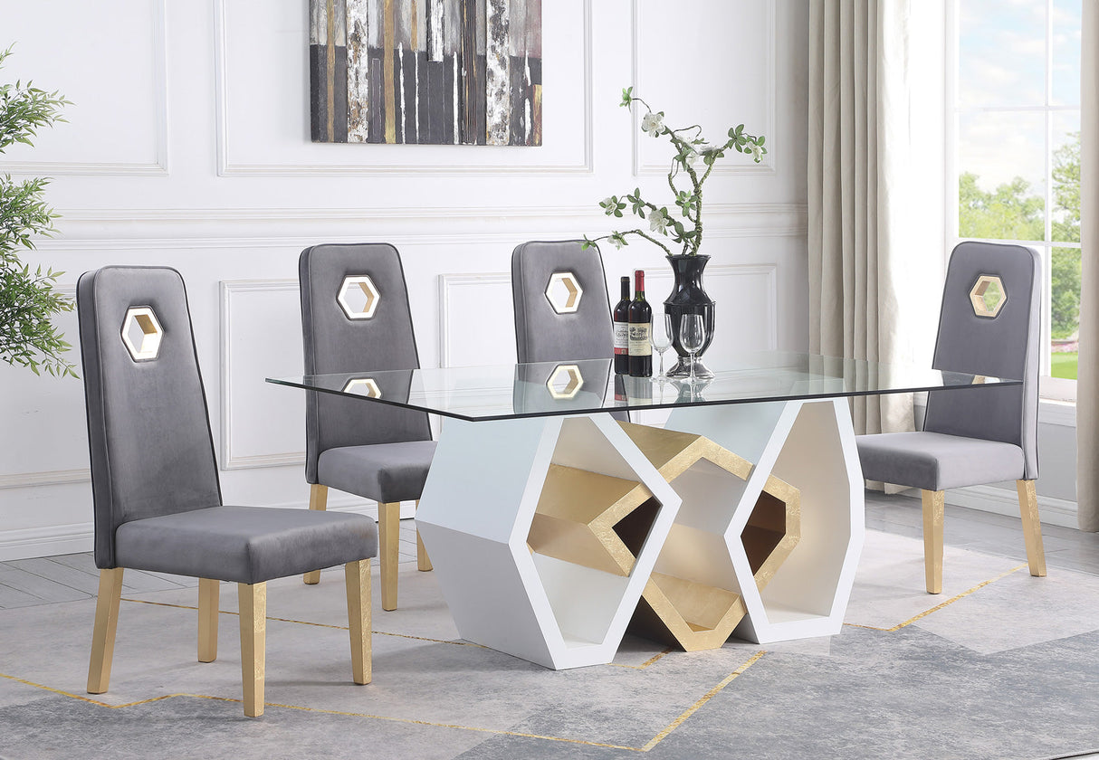 Tavolo dining set featuring a geometric tempered glass table with white and gold hexagonal base and grey velvet chairs.