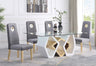 Tavolo dining set featuring a geometric tempered glass table with white and gold hexagonal base and grey velvet chairs.