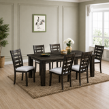 Dining room with a dark wood table and chairs on a brown rug.