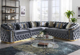 Gray velvet l-shaped sectional sofa with deep button tufting and gold metal legs