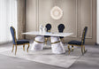 Contemporary rectangular dining table with a white faux marble top and dual white sculptural pedestal bases featuring gold accents.