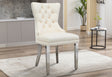 Angled side profile of the tufted dining chair showing gold nailhead trim