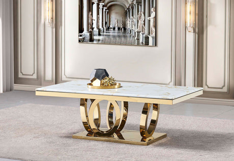 FOAK Tamara coffee table set featuring white marble tops and intertwined polished chrome oval bases in a modern living room.