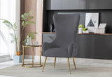 Detail of the polished gold finish on the metal chair legs.