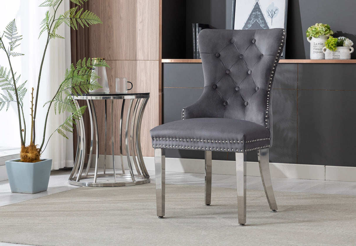 Two cream velvet dining chairs arranged in a contemporary dining room setting