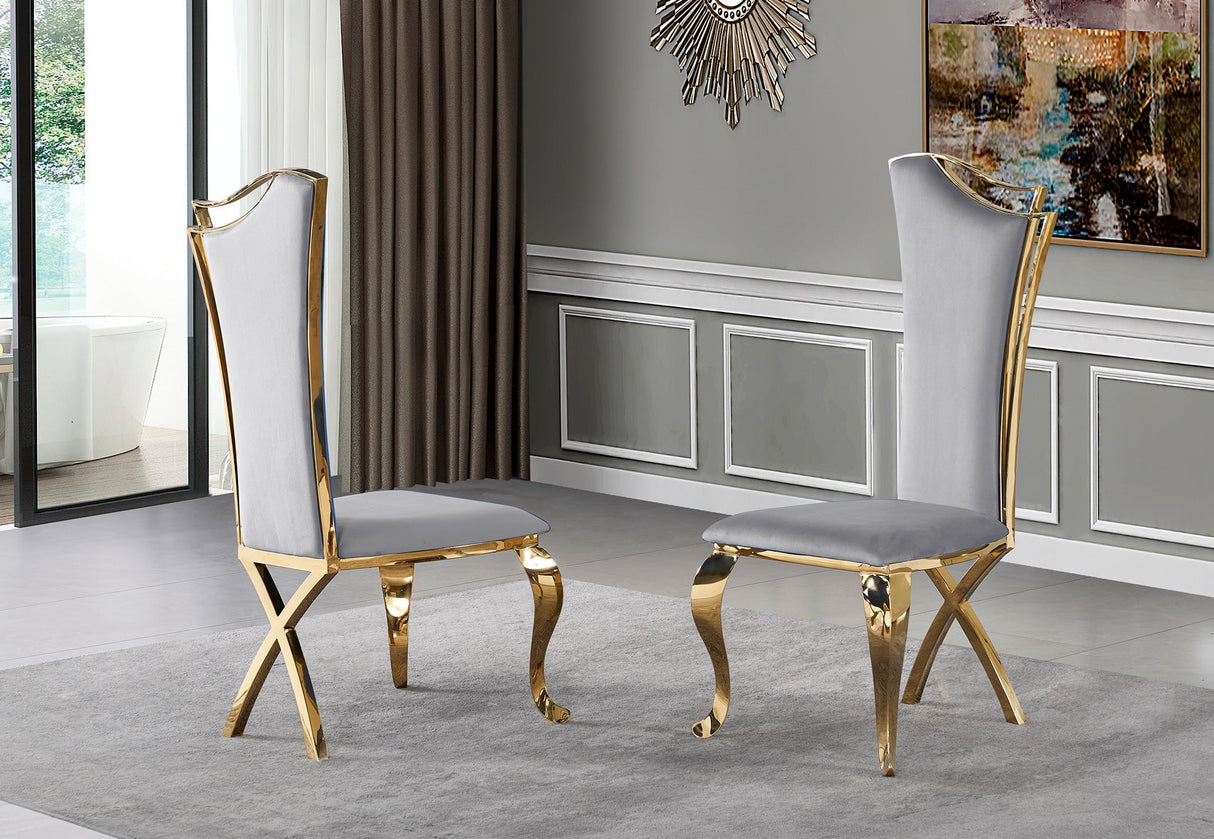Detail view of gold stainless steel frame and black velvet upholstery