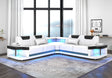 Contemporary white and black faux leather L-shaped sectional sofa with integrated LED lighting along the base.