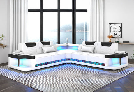 Contemporary white and black faux leather L-shaped sectional sofa with integrated LED lighting along the base.