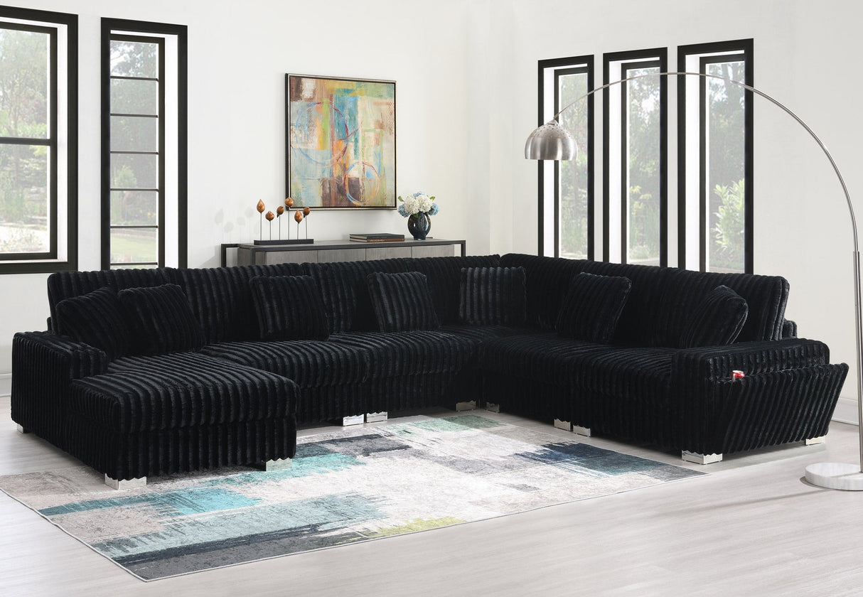 Side profile of brown shaggy velvet sectional showing metallic legs