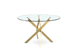 Emilia Round Glass Dining Table featuring a clear tempered glass top and a gold-finished metal crisscross base.