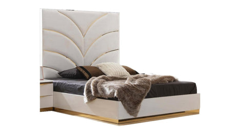 White velvet upholstered headboard with gold-plated geometric pattern and frame.