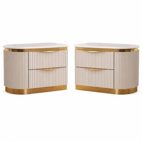 A pair of modern nightstands with cream ribbed fronts, white marble tops, and gold metal trim and drawer pulls, shown on a plain white background.